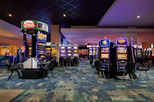a bunch of slot machines in a casino at Embassy Suites by Hilton San Juan - Hotel & Casino in San Juan