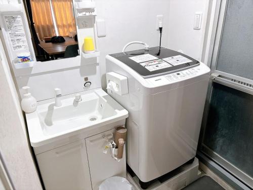 Kuchyň nebo kuchyňský kout v ubytování GoodStay301