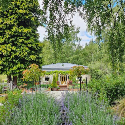 a house with a garden in front of it at Carrowmore House in Naseby