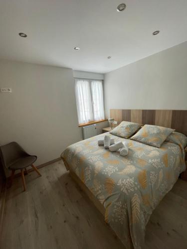 a bedroom with a bed with two candles on it at Apartamento Casablanca in Potes