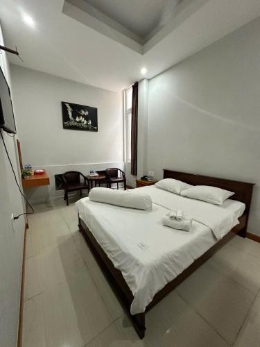 Cama o camas de una habitación en Rich Hotel