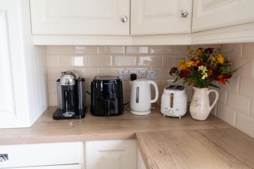 a kitchen counter with various appliances on a counter top at Fairy Fort Farm in Mitchelstown
