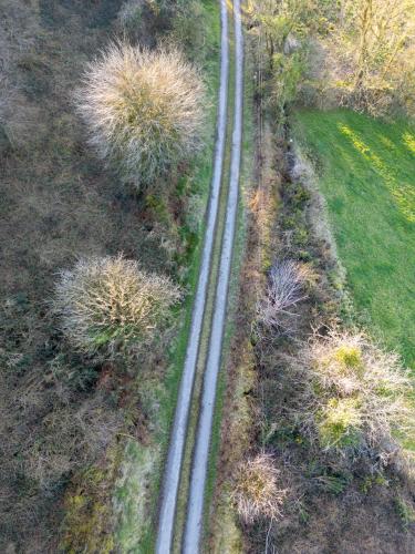 an aerial view of railroad tracks in a field at Fairy Fort Farm in Mitchelstown