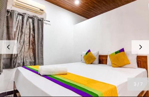 Postel nebo postele na pokoji v ubytování Baga Beachway, GuestHouse