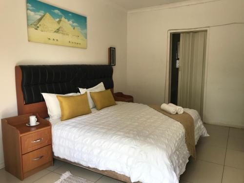 Postel nebo postele na pokoji v ubytování Den Accommodation