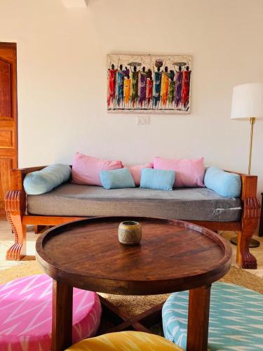 a living room with a couch and a table at Nyota ya Amani, Shela Lamu in Shela