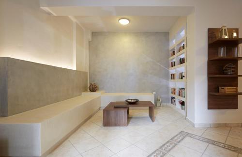 a living room with a tub and a table at Studios Marios in Kamari