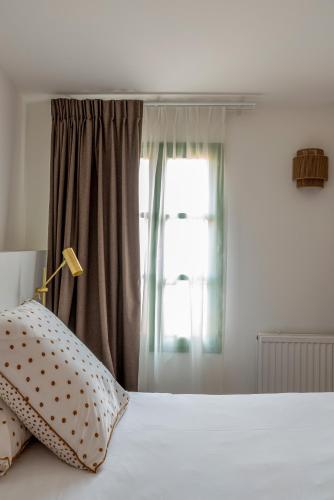 Postel nebo postele na pokoji v ubytování Maison d'Hôtes Les Sources