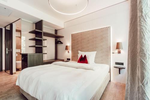Postel nebo postele na pokoji v ubytování Eriks Hotel