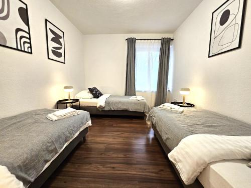 Giường trong phòng chung tại City Apartments