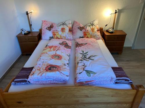 a bedroom with two beds with pillows at KARL Apartment in Interlaken
