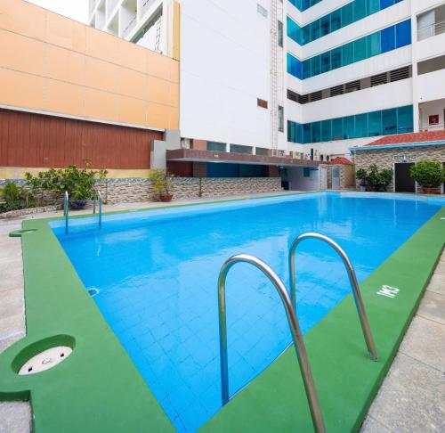 a large swimming pool in a building at Nha Trang Lodge Hotel in Nha Trang