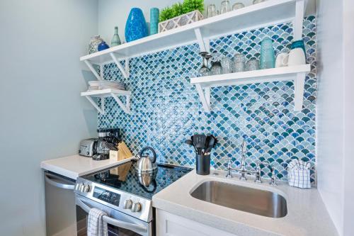 a small kitchen with a sink and a stove at Villa #6 Starfish in Holmes Beach