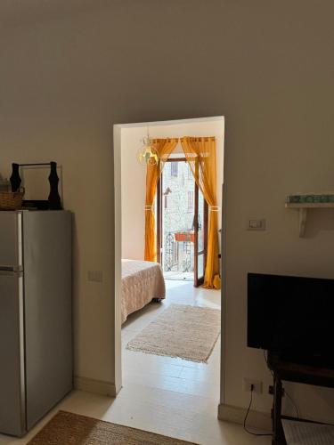 Ένα ή περισσότερα κρεβάτια σε δωμάτιο στο Casa Vacanze DONNA LUCREZIA
