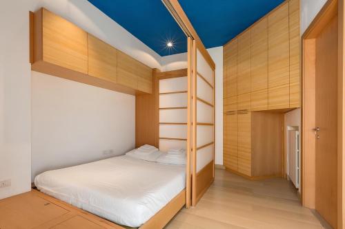 a bedroom with bunk beds and a blue ceiling at Torre Matta Historic Home in Otranto