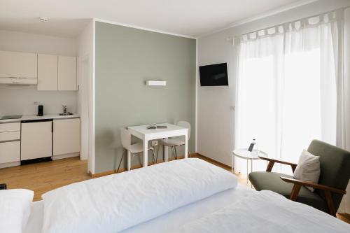 Posteľ alebo postele v izbe v ubytovaní Residence Isarcus