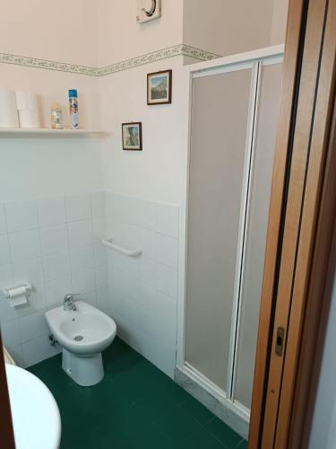 a bathroom with a shower and a toilet and a sink at Sicily & Sun Letojanni Taormina in Letojanni