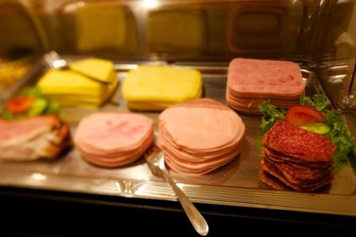 a tray with several different types of sandwiches on it at Pension Elisabeth in Westendorf