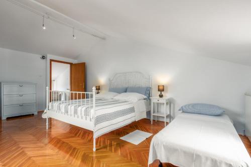 Postel nebo postele na pokoji v ubytování Silvia Sea View Funtana