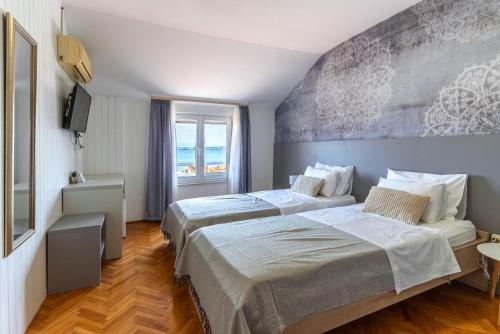 Ένα ή περισσότερα κρεβάτια σε δωμάτιο στο Pension Rušev