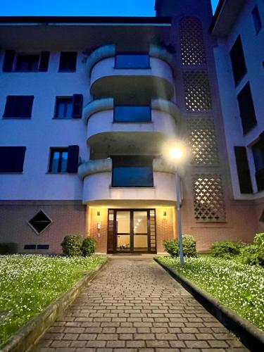 a building with a street light in front of it at GreenForum in Assago