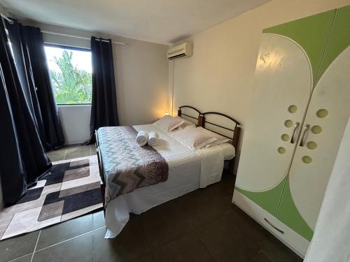 a small bedroom with a bed and a window at Chez Lisa in La Gaulette