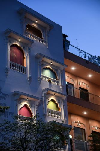 a blue building with colorful windows on it at Satoria Villa in Jaipur