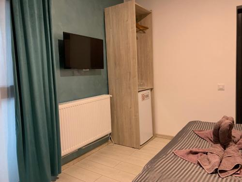 TV a/nebo společenská místnost v ubytování Neversea house