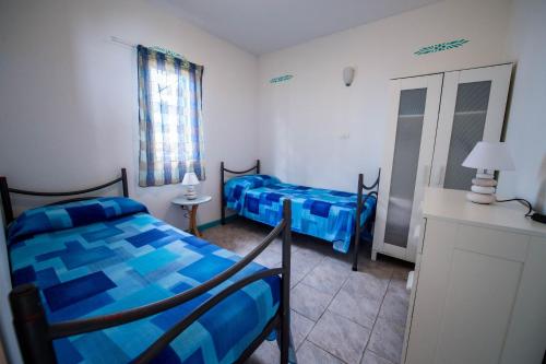 Кровать или кровати в номере Marina del Cantone Chalet