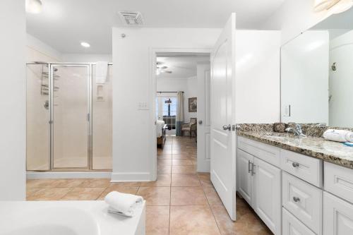 a bathroom with a shower and a sink at The Oasis at Orange Beach 2208 (Phoenix West II) in Orange Beach