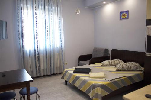 a hotel room with two beds and a window at Studio in the city center metro Historical Museum in Kharkiv