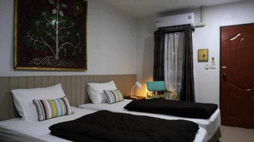 Postel nebo postele na pokoji v ubytování Koko Palm Inn