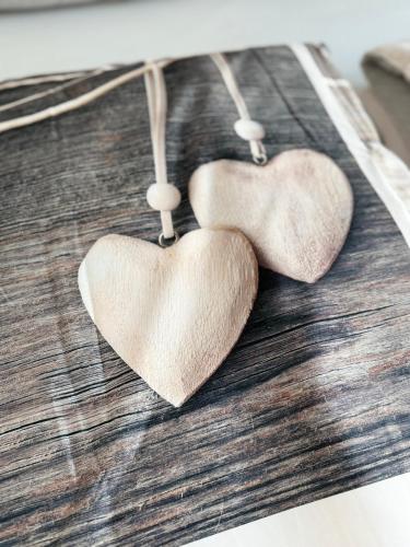 two heart shaped earrings hanging from a table at Sunny escape hoek van holland in Hoek van Holland