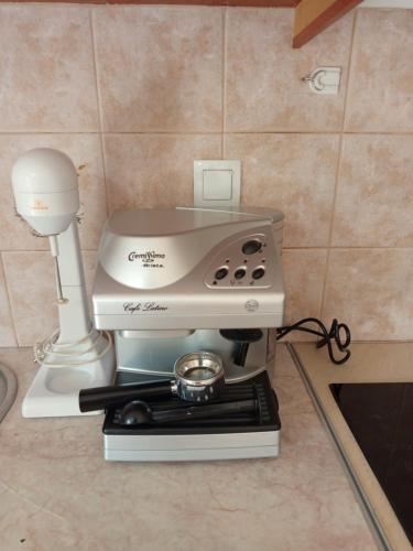 a coffee machine sitting on top of a counter at Dora and Sandy apartments 2 in Oikonomiánika