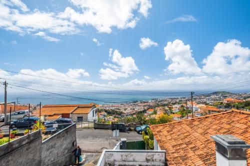 a view of a city from the roof of a building at Funchal Ocean Terrace APT in Funchal