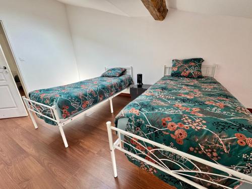 a bedroom with a bed and a bench in it at La Terrasse vue étangs, Babyfoot, jeux de société by BookingFuté in Socourt