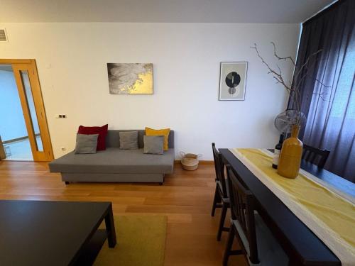 a living room with a couch and a table at Riverside Expo in Lisbon