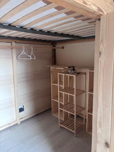 a room with a wooden ceiling with shelves in it at Valley View Studio in Saint Vincent