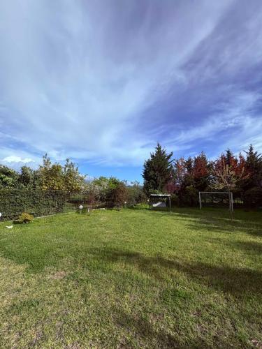 a field with two goal posts in the grass at Phivos Home & Garden in Messini