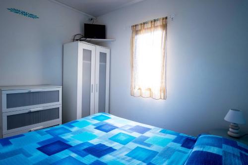 Кровать или кровати в номере Marina del Cantone Chalet