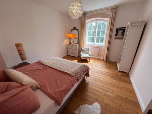 a bedroom with a large bed and a window at Villa Bella Vita in Seeboden