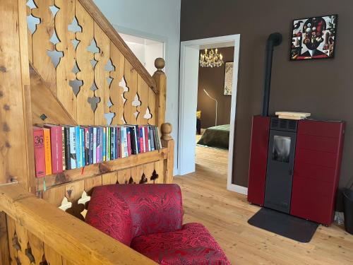 a room with a staircase with books on it at Villa Bella Vita in Seeboden