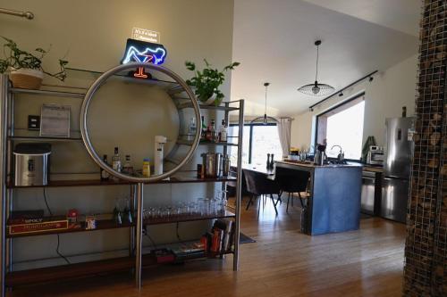 a room with a mirror and a kitchen with a table at Skaam Cabin Luxe Hideaway with a Naughty Side in Wolseley