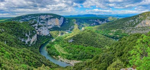 an aerial view of a river in a canyon at Studio Evasion Ardéchoise in Villeneuve-de-Berg