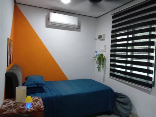 Ένα ή περισσότερα κρεβάτια σε δωμάτιο στο KAMI roomstay 2