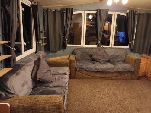 a living room with two chairs and a couch at 3 bed 2 bath Static on parkdean morecambe in Morecambe