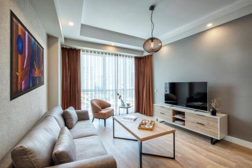 TV a/nebo společenská místnost v ubytování Sirius Town Residence and Spa