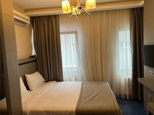 Acar Suite Hotelにあるベッド