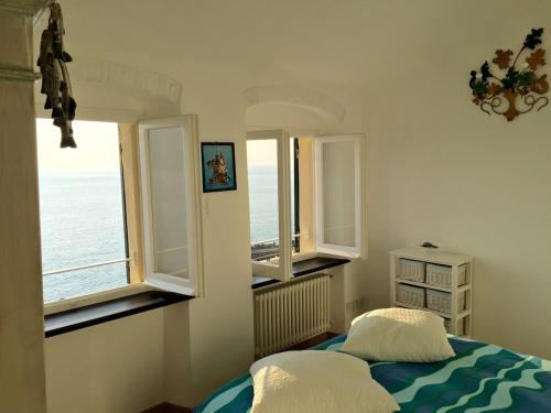 Ένα ή περισσότερα κρεβάτια σε δωμάτιο στο Casa fronte mare