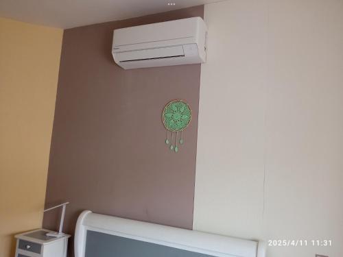 a room with a air conditioner on the wall at Chez Lilly in Avignon